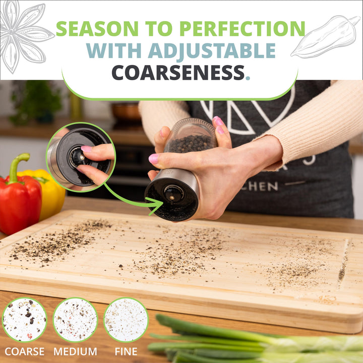 Twisting the top of the pepper grinder to adjust from fine to coarse over a chopping board