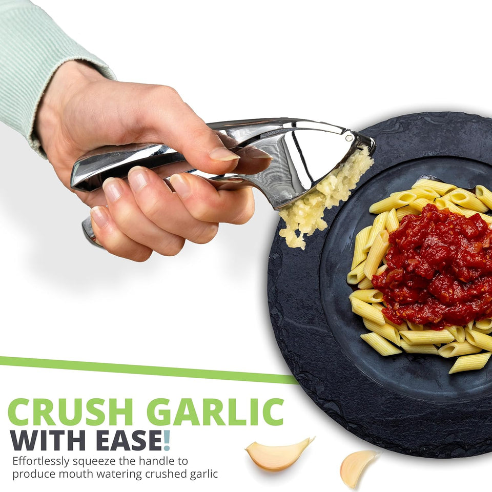 Garlic crusher squeezing garlic over a bowl of pasta, one-handed